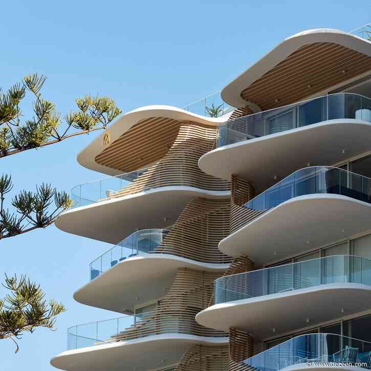 Retractable screens shelter seafront apartment block in Australia by Koichi Takada Architects