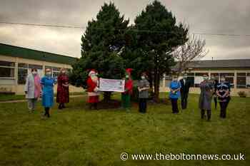 'Santa and his elf' raise vital funds for Bolton NHS breast cancer unit