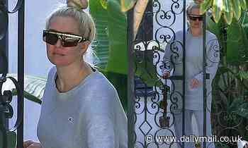 Erika Jayne picks up food delivery at her front door in sweats and edgy shades - Daily Mail
