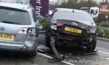 HGV smashes into 17 cars to leave trail of destruction outside Premier Inn - Daily Mail