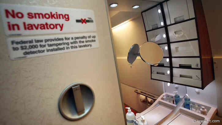 Woman quarantines in plane toilet over positive Covid test