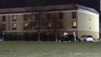 1 officer is dead and a second in critical condition after a shooting at an Illinois hotel