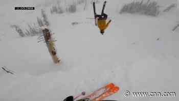 Skier buried head-first in snow after backflip attempt goes wrong