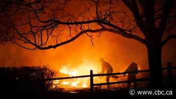 Colorado wildfires force tens of thousands to evacuate homes over holidays