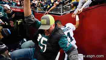 Railing collapses, fans fall as Hurts walks past