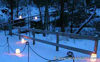 Snowshoe or hike a twinkling lit trail beneath a night sky - Pine and Lakes Echo Journal