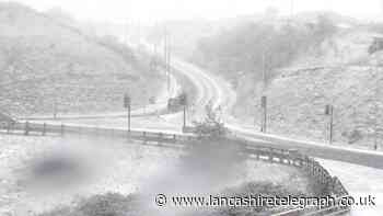 Grane Road closed by police as snow falls across Lancashire