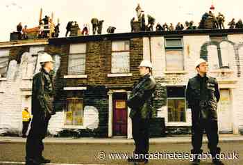 Demonstrators took to the rooftops in protest against M65