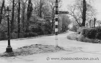 East London road junction in 1920s showing AA direction signs