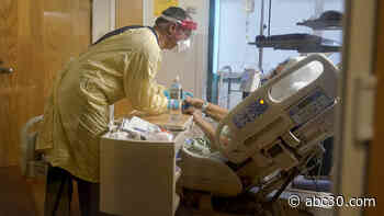 US hospitals strained with influx of patients amid latest COVID surge, staffing shortages