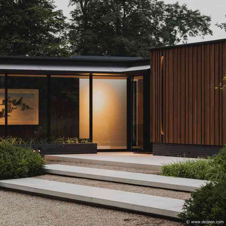 Thermo-ash cladding gives tone and texture to Dutch forest house
