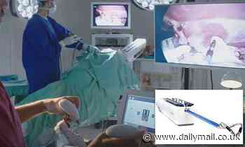 Robot with 'claws' at the end of humanoid-shaped arms performing hysterectomies in the US