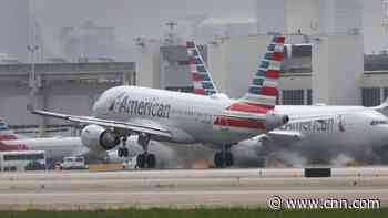 A man was apprehended after damaging a plane during boarding process, American Airlines says