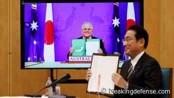 China grumbles as Japan, Aussies ink treaty to meld forces