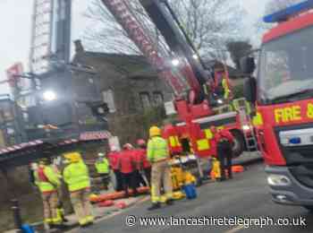Man rescued after falling down 15ft embankment close to train tracks