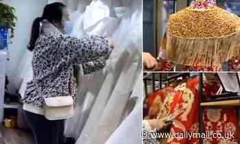 Furious bridezilla destroys 32 wedding dresses worth £8,000 at Chinese bridal salon in deposit row 