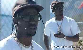 Travis Scott looks relaxed as he's pictured leaving Cabo... after Kylie shares baby shower snaps - Daily Mail