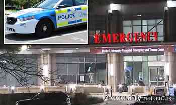 Man in police custody is shot dead in emergency room of Durham hospital after grabbing officer's gun