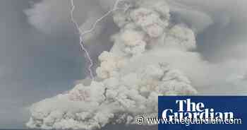 Tonga volcano: smoke and lightning seen before eruption that caused tsunami – video
