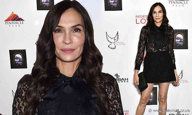 Famke Janssen looks leggy in black lace cocktail dress at LA screening of her movie Redeeming Love - Daily Mail
