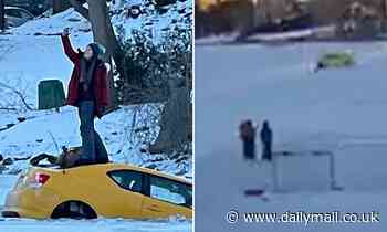 Woman driving on frozen river in Canada crashes through ice and takes a selfie standing on the roof