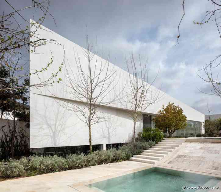 Paritzki & Liani Architects builds triangular house with white stone walls