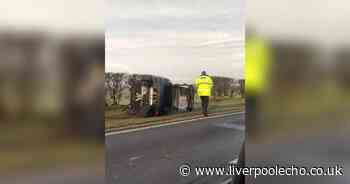 Formby Bypass shut after Ford Focus rolls on to its side