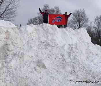 Vidler's 5 & 10 owners dub 21' snow pile in the back of their lot "Mt. Go Bills"