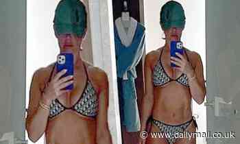 Rebekah Vardy flaunts her rock-hard abs as she slips into a chic bikini