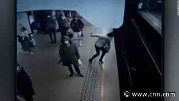 Woman narrowly survives push from platform in front of approaching train