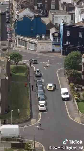 WATCH: Stunned onlookers watch on as knifeman filmed walking around Brighton