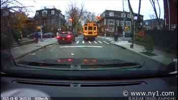 Exclusive dash cam video shows school buses running red lights - Spectrum News NY1