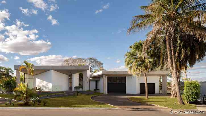 Light wells puncture roof of concrete house in Brasília by Debaixo do Bloco Arquitetura