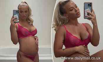 Tammy Hembrow flaunts her growing baby bump in racy pink lingerie