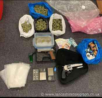 Guns, cash and drugs seized from Burnley house as two arrested