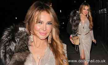 Lizzie Cundy, 53, puts on a leggy display in sparkling sequin dress and studded boots