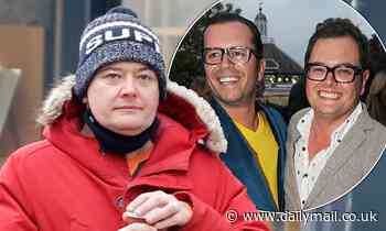 Alan Carr looks straight-faced as he's seen for first time since split from husband Paul Drayton