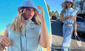 Model Elsa Hosk sports a baby blue Prada vest and jeans while showing off her street style in Venice