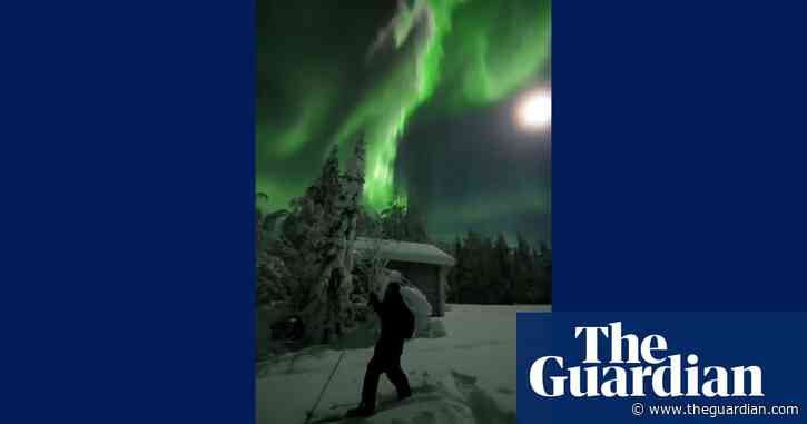 Skier captures spectacular northern lights display in Finland – video
