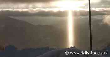 Huge 'alien tractor beam' shines over mountains for three hours baffing locals - Daily Star