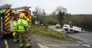 Paramedics at crash scene after vintage car lands on its roof - Grimsby Live