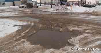 Edmonton road crews addressing pooling water as snow-clearing efforts continue