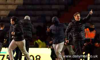 Oldham Athletic supporters clash with stewards during club's humiliating 6-0 loss to Wigan - Daily Mail