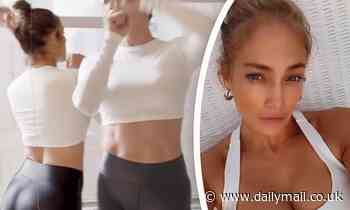 Jennifer Lopez, 52, shows off her incredibly toned tummy as she dances in a crop top