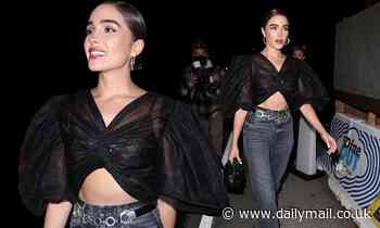 Olivia Culpo bares her toned midriff in a black crop top while out in West Hollywood with pals