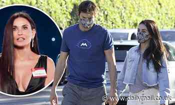 Mila Kunis holds hands with Ashton Kutcher... after starring in THAT ad with his ex-wife Demi Moore