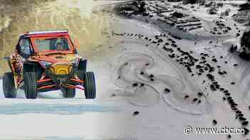 Frozen lake becomes racetrack for snow drifters