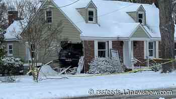 Car crashes into unoccupied home in Norfolk during winter weather