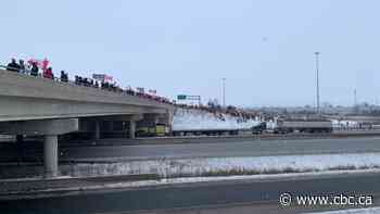 Trucker convoy draws supporters, police safety warnings while rolling through Ontario