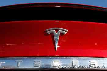 Tesla posts record full-year earnings as vehicle sales soar - St Helens Star